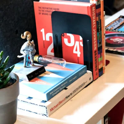 Six digital marketing agency books about marketing strategy stacked neatly
